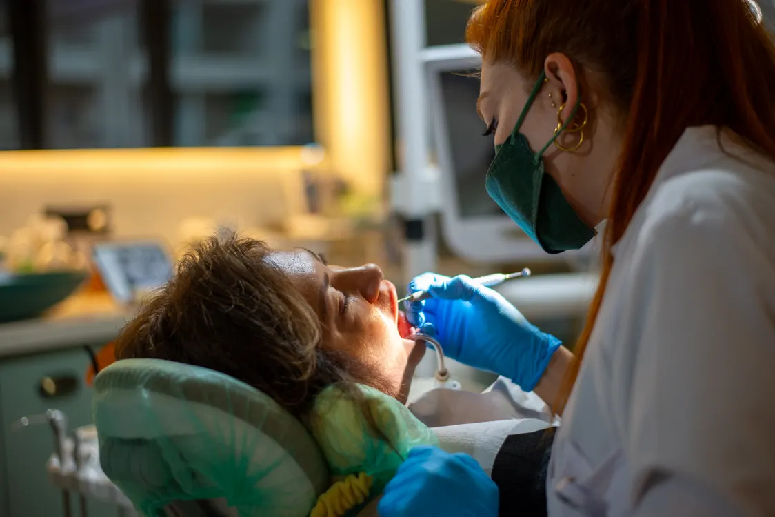 Dentist providing attentive care to a patient in a treatment room