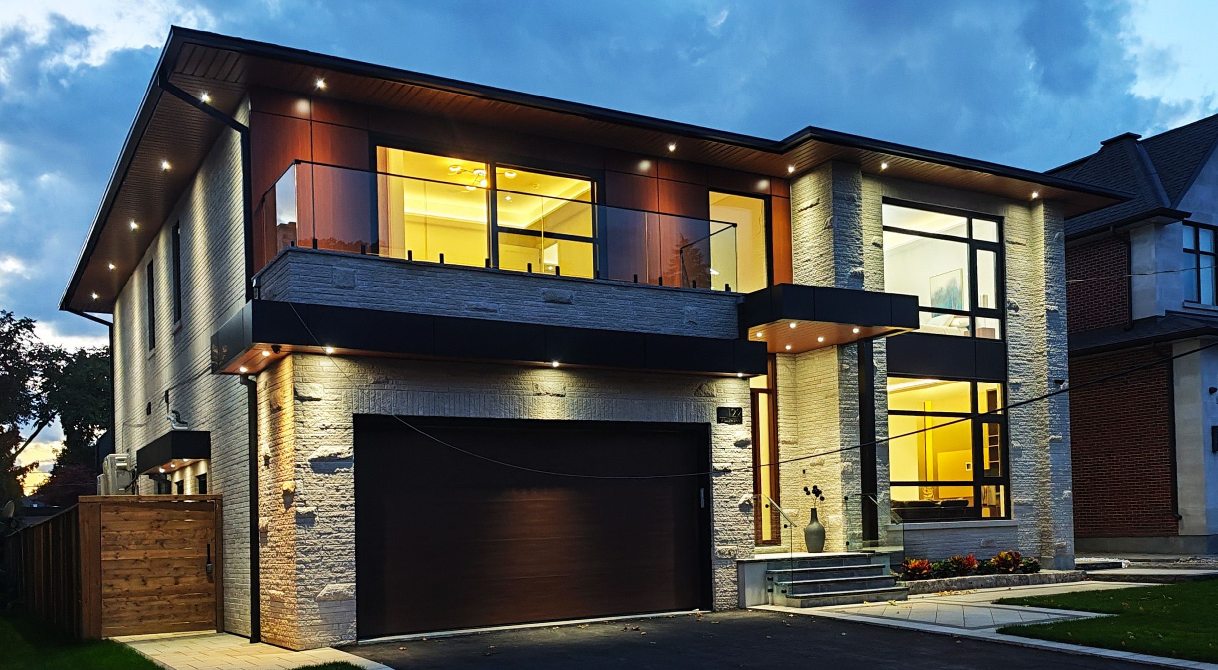 Angular contemporary home with illuminated windows