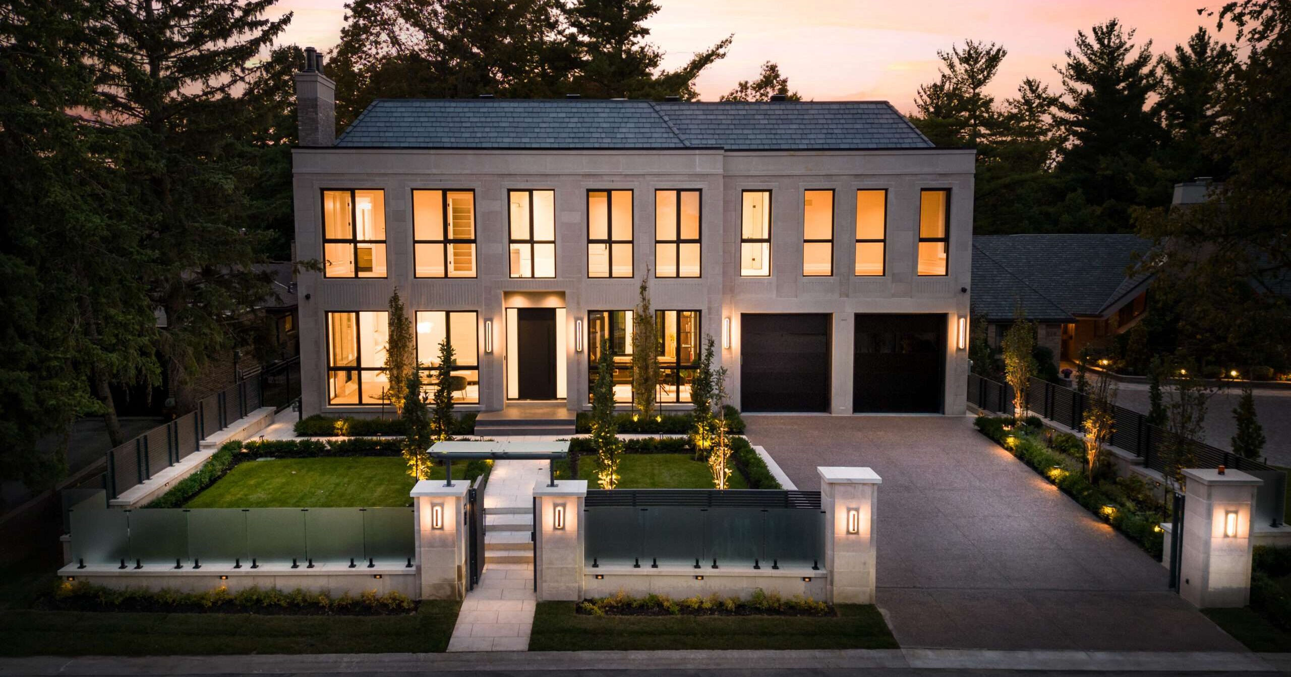 Modern estate at twilight sold in Oakville