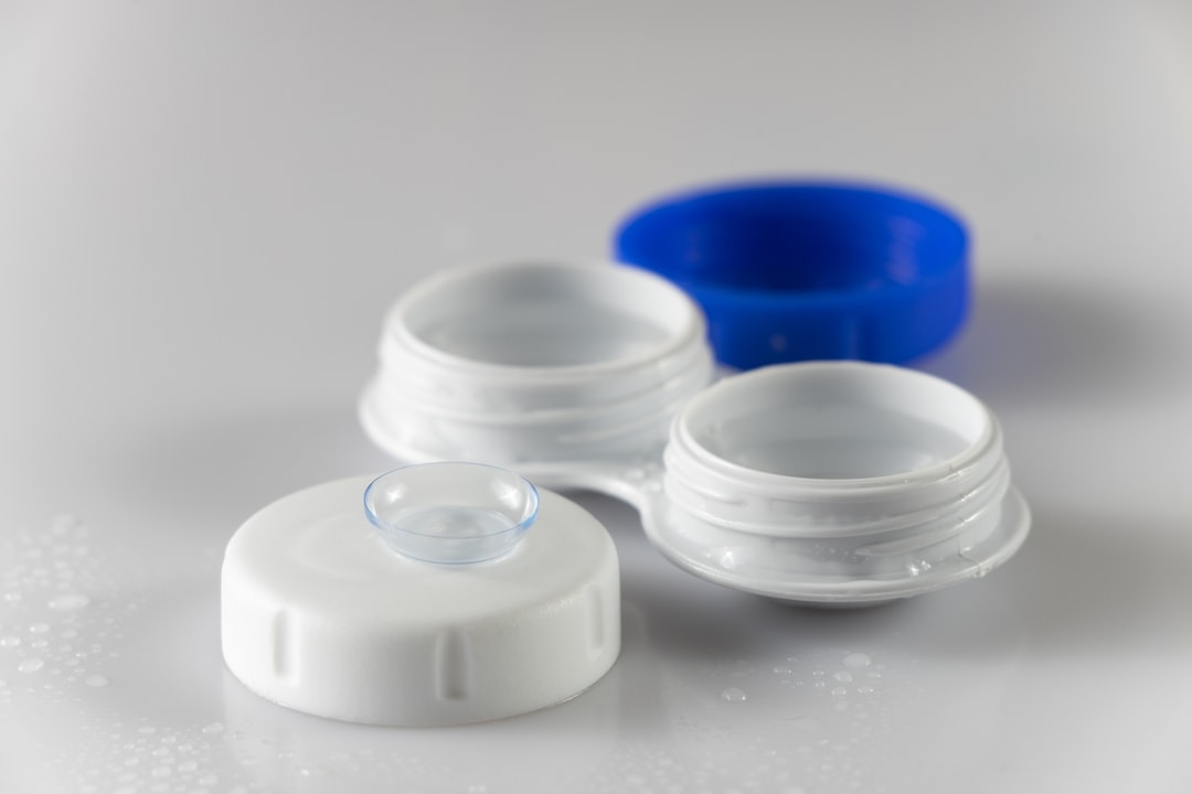 Contact lens beside an open lens case