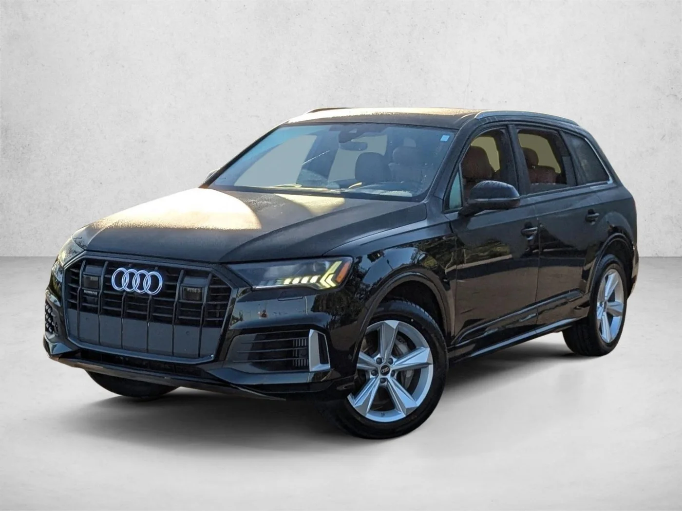 Black 2023 Audi Q7 premium SUV photographed at a dealership