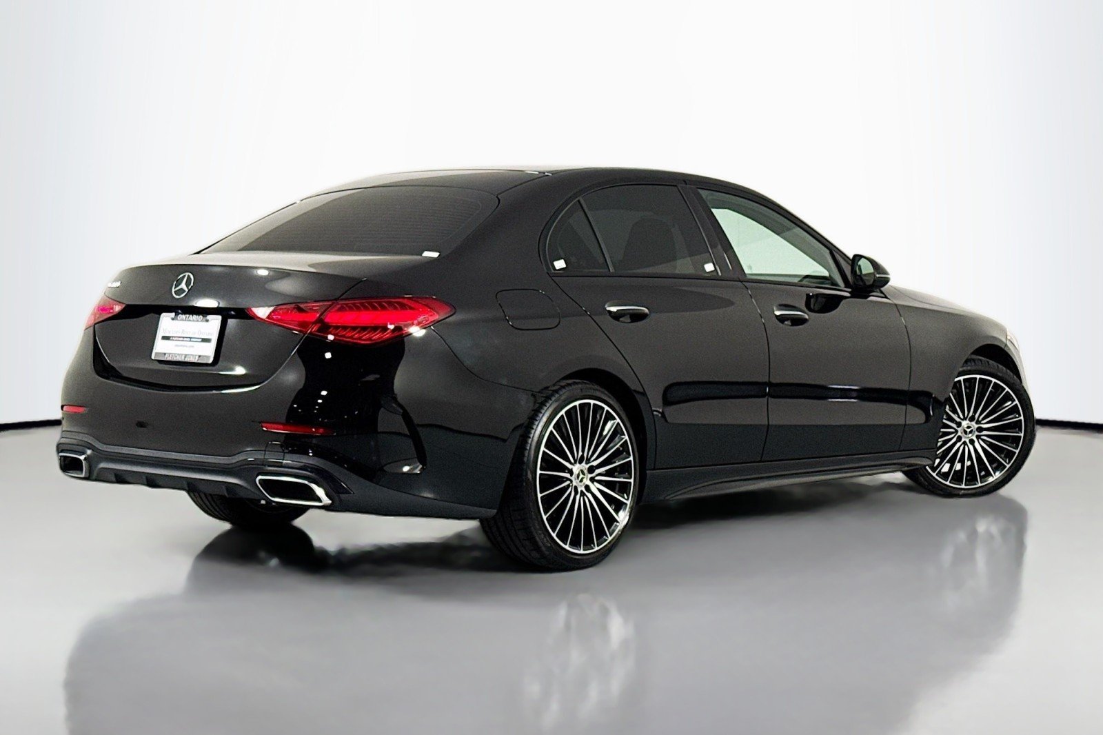 Black 2023 Mercedes-Benz C 300 sedan photographed at a dealership