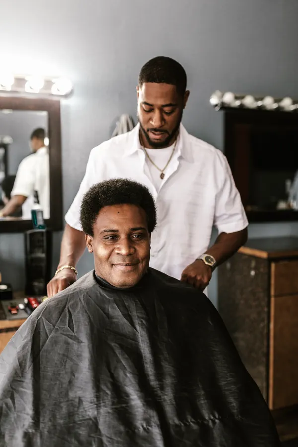 Barber preparing tools at a barber station